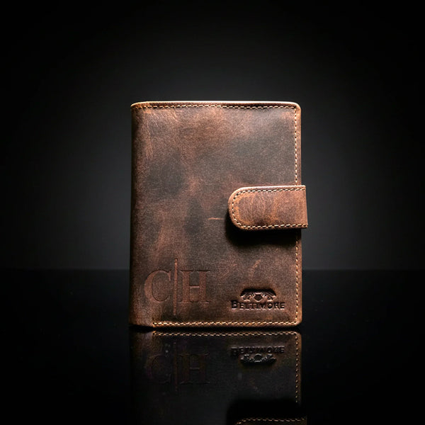 Personalized brown leather wallet with stitched flap closure for men on black background